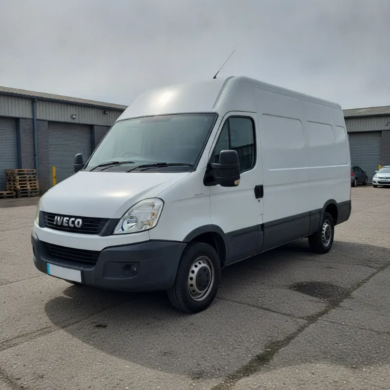 An Iveco Daily large panel van parked on a UK industrial estate forecourt