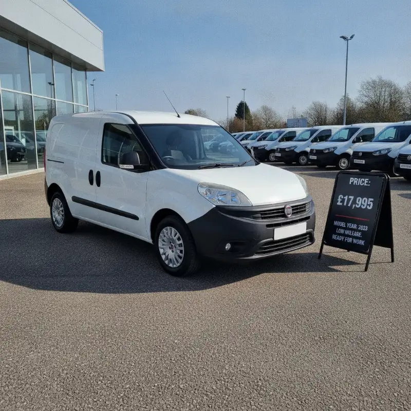 A Fiat Doblo small van on a dealership forecourt