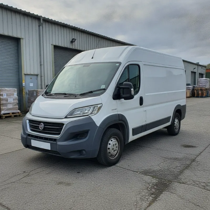 A Fiat Ducato large panel van parked on a UK industrial estate forecourt