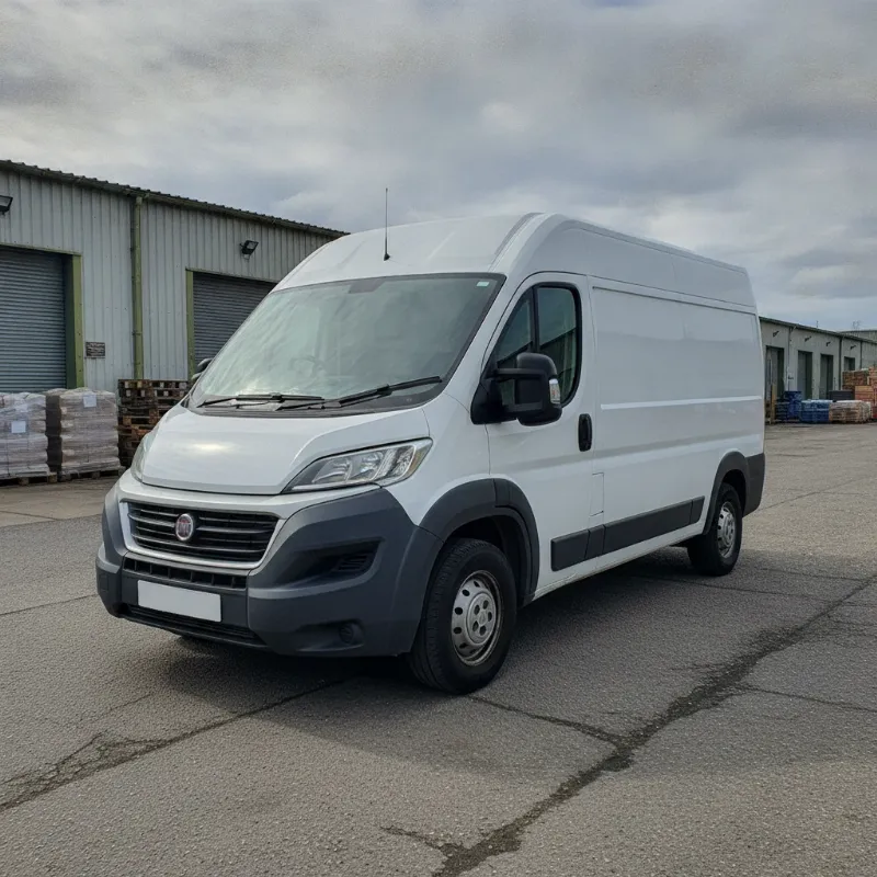 A Fiat Ducato large panel van parked on a UK industrial estate forecourt