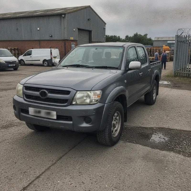 A Toyota Hilux double cab pickup parked at a UK trade premises